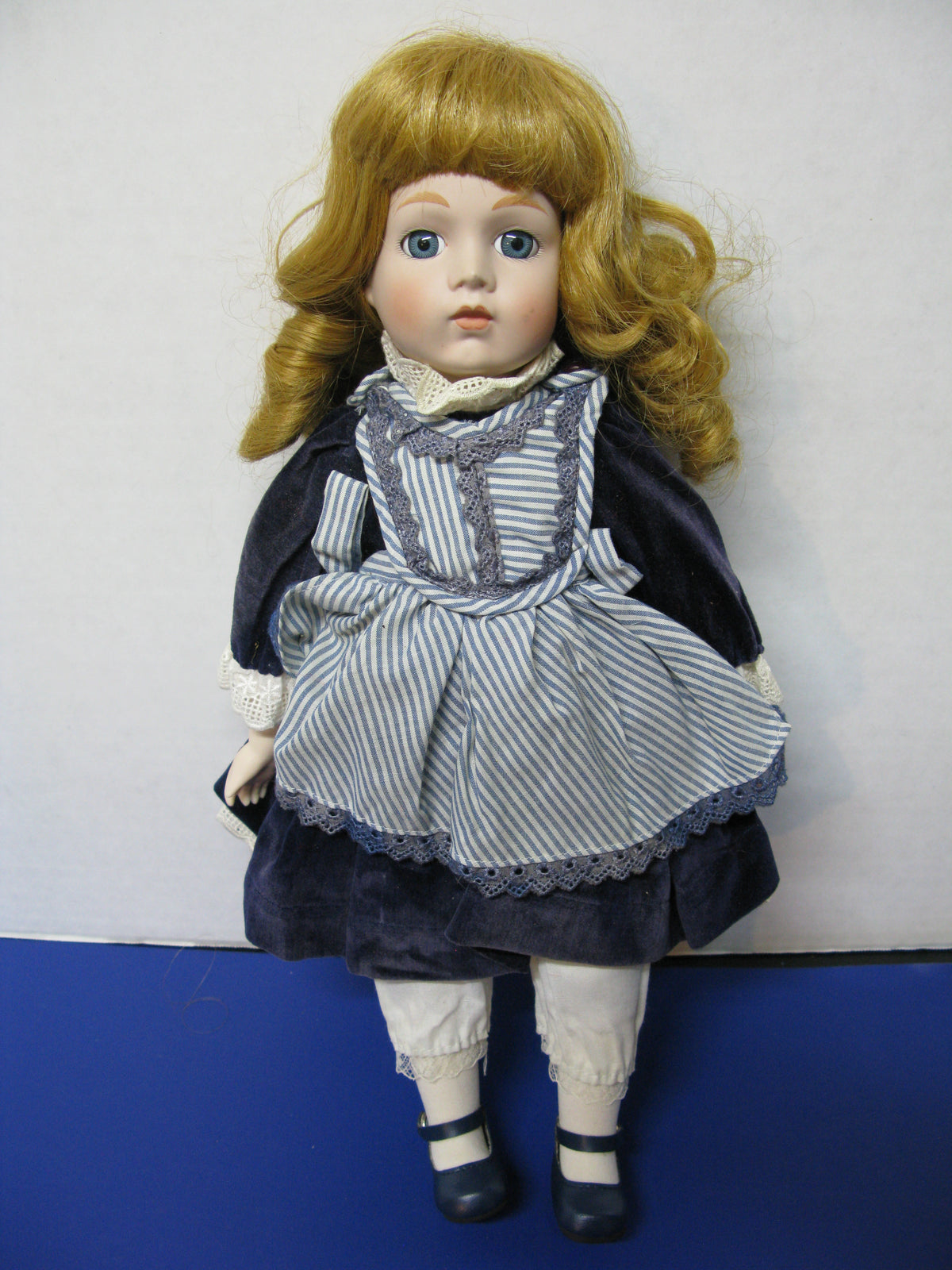 Porcelain Doll in Blue Dress — The Pop Culture Antique Museum